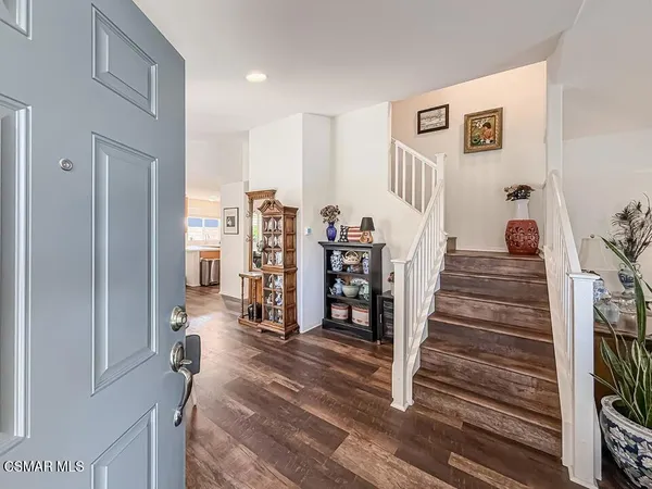 a view of entryway with livingroom and stairs