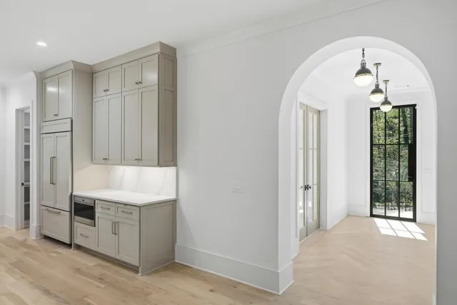 a view of a kitchen with electric appliances