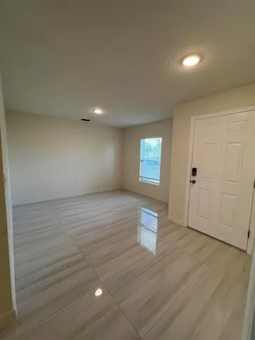 a bathroom with a toilet and a bathtub