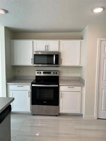 a room with a bed and window