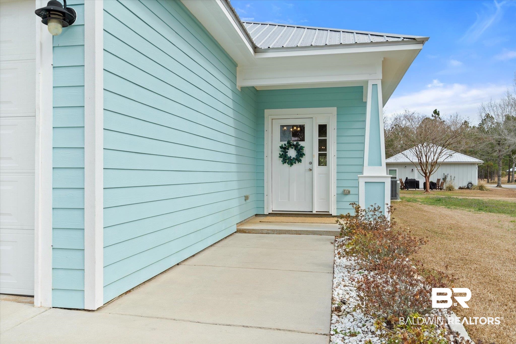 8056 Carmel Circle Foley, AL 36535 - Photo 26 of 28 View of exterior entry with a yard