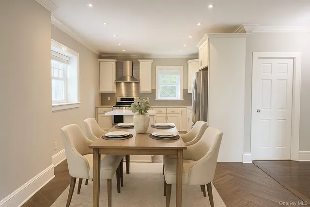 a view of a dining room with furniture and window