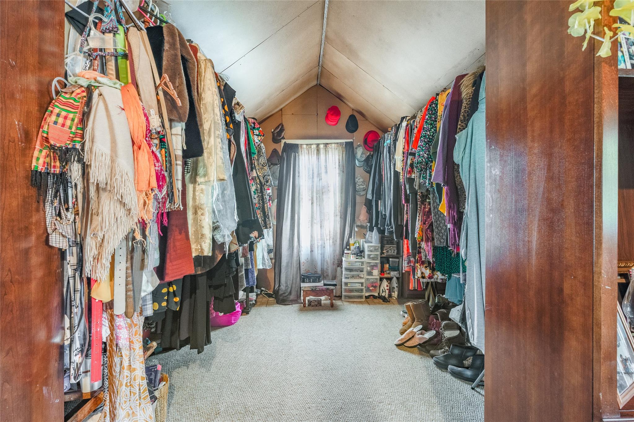 17 Lawrence Road Poughkeepsie, NY 12601 - Photo 14 of 17 Walk in closet with carpet flooring and vaulted ceiling