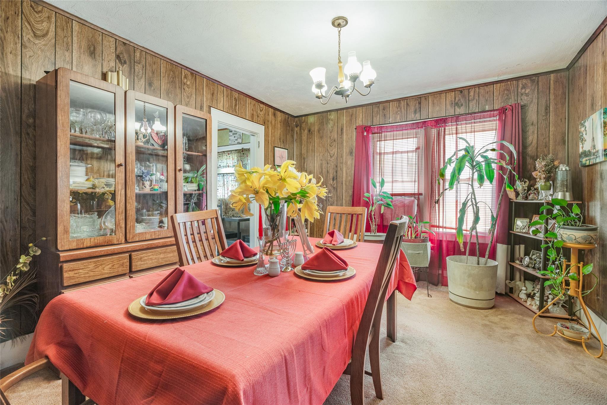 17 Lawrence Road Poughkeepsie, NY 12601 - Photo 6 of 17 Carpeted dining space featuring wooden walls and a notable chandelier
