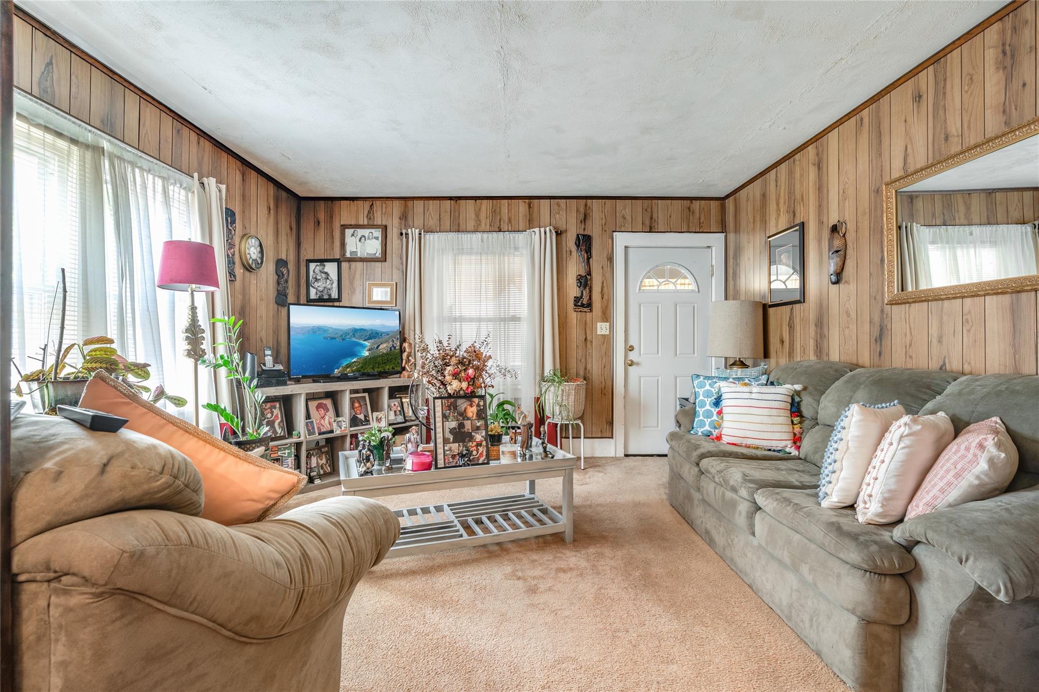 17 Lawrence Road Poughkeepsie, NY 12601 - Photo 8 of 17 Living area featuring wooden walls and light colored carpet