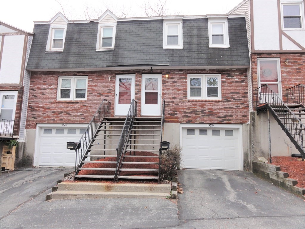 1955 Middlesex Street, Unit E Lowell, MA 01851 - Photo 1 of 20 a front view of a house with stairs