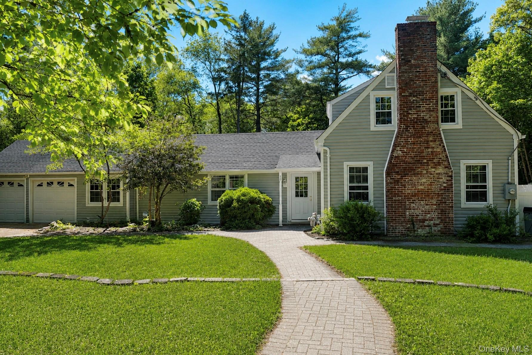 80 Mt Pleasant Road Smithtown, NY 11787 - Photo 1 of 27 a front view of a house with a yard