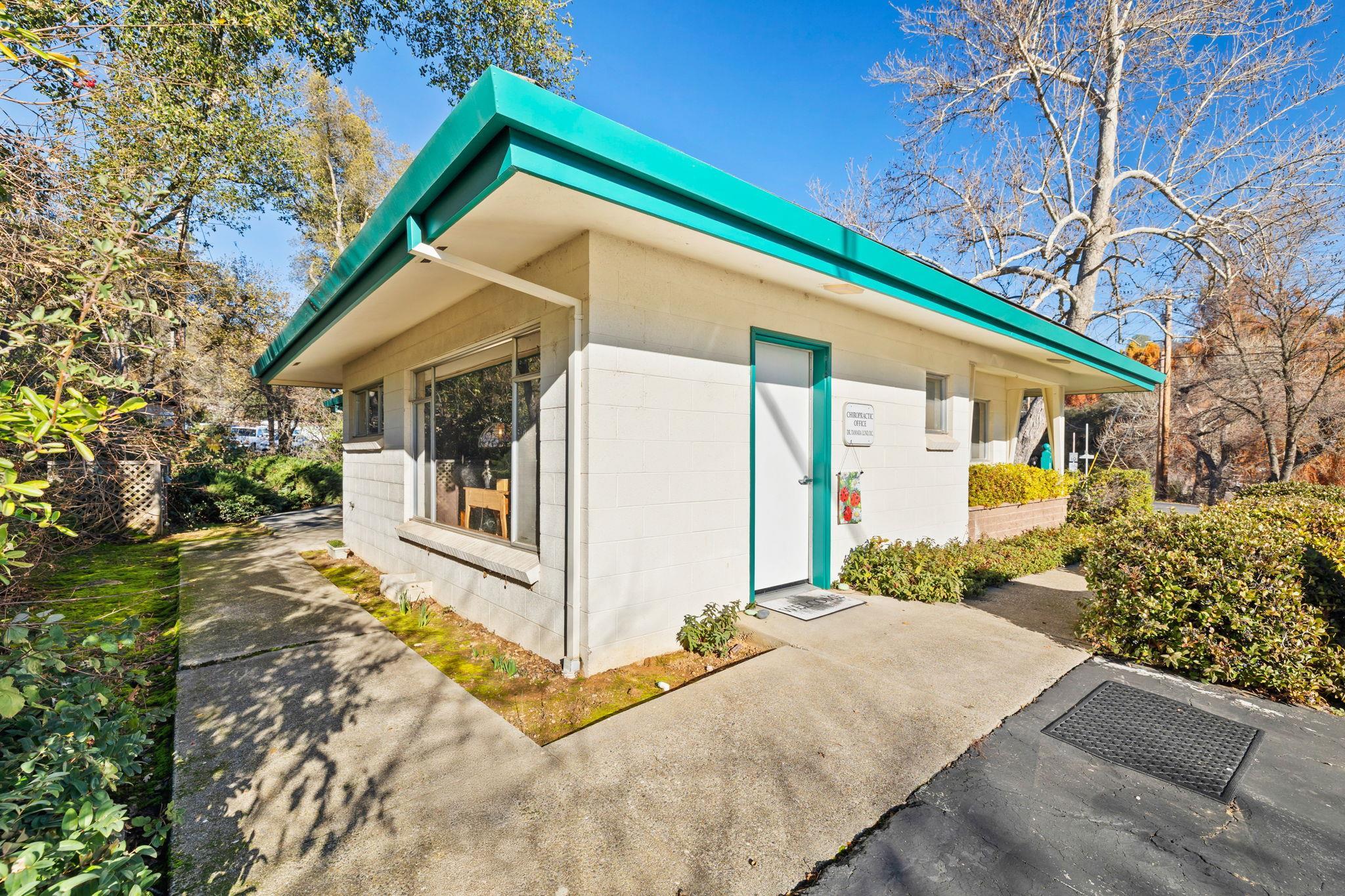 View of side of home featuring concrete block siding