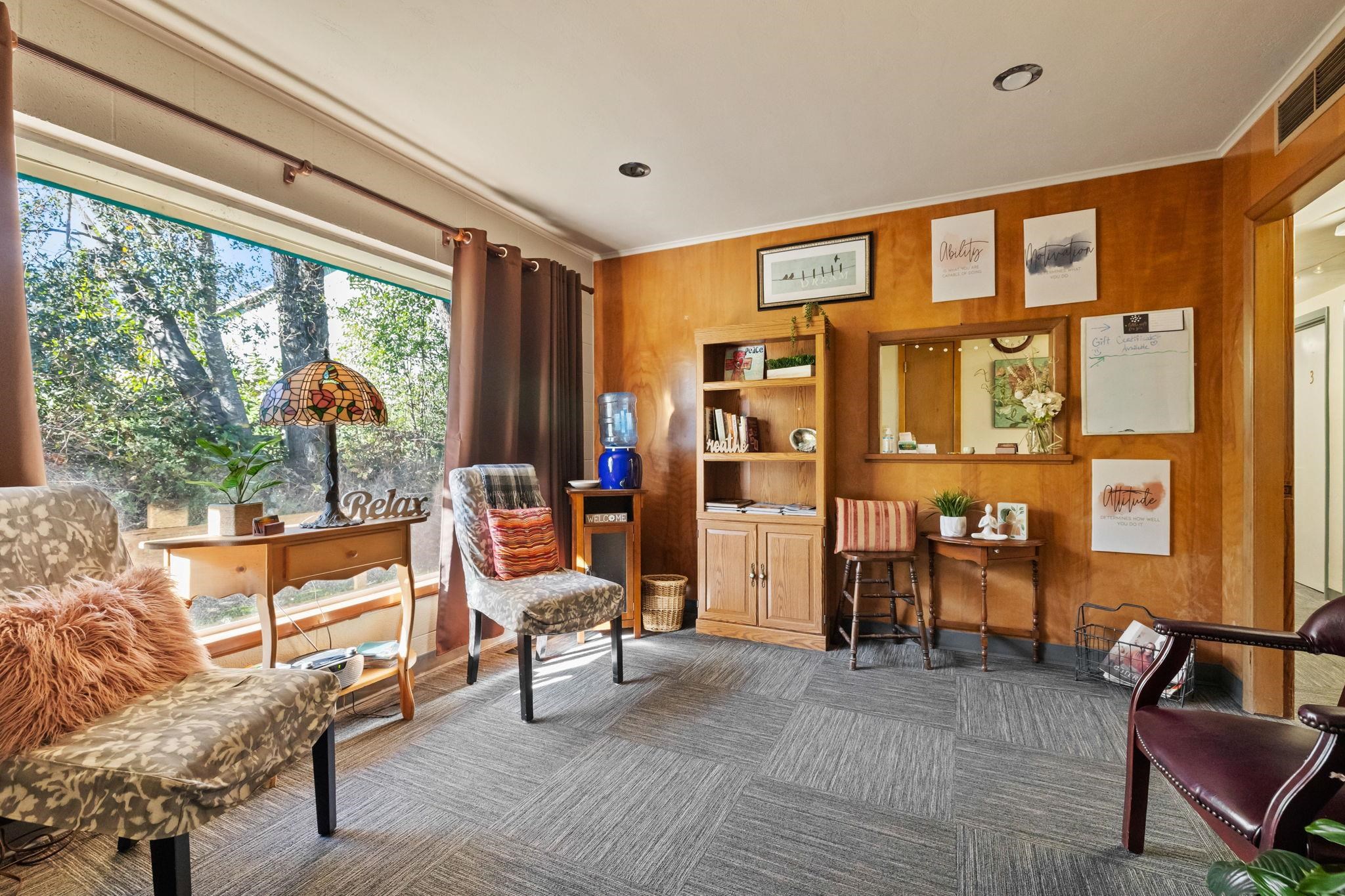 6 South Forrest Sonora, CA 95370 - Photo 6 of 17 Living area with wooden walls and crown molding