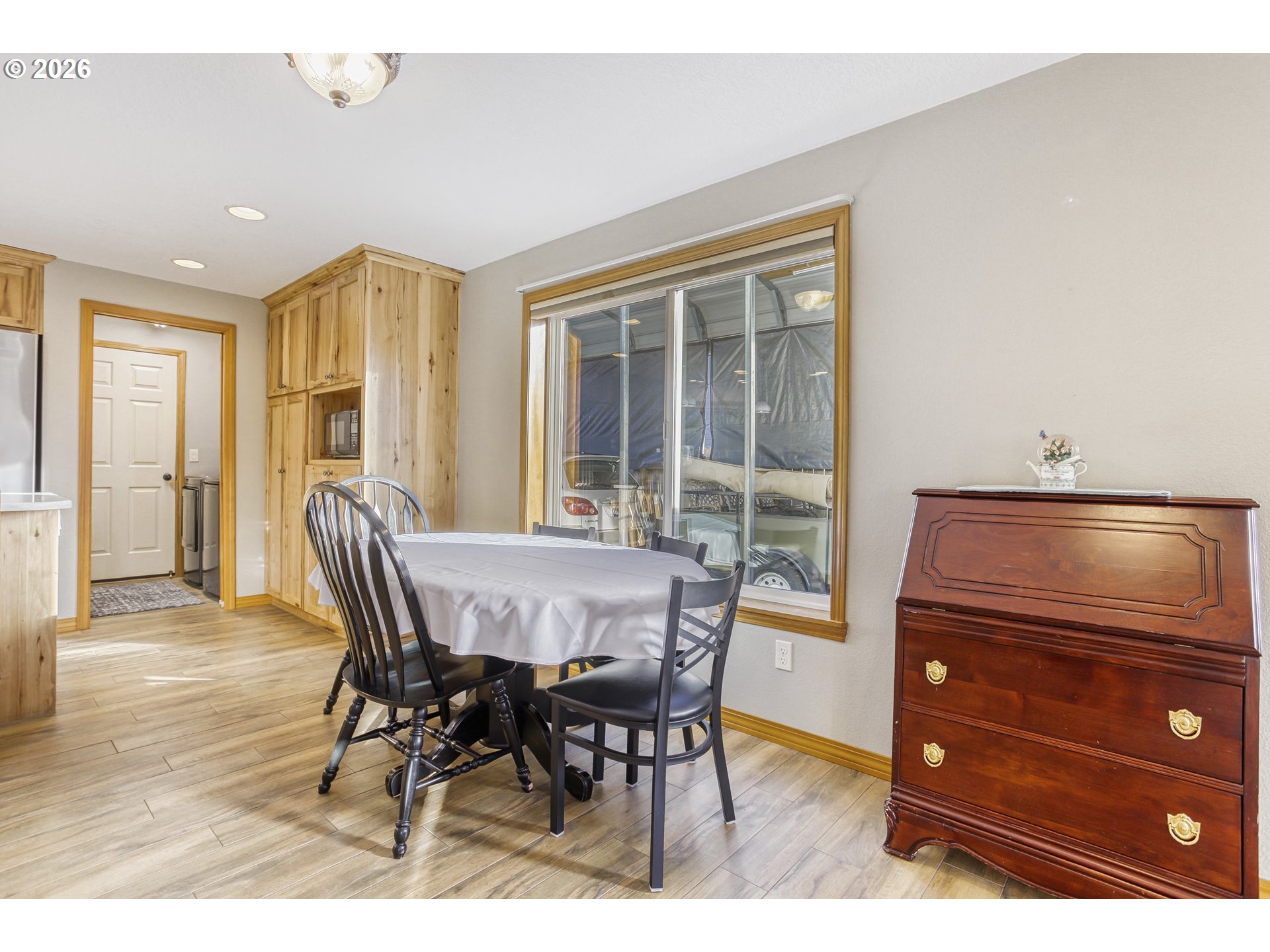 357 Southeast 7th Avenue Canby, OR 97013 - Photo 11 of 29 a dining room with a wooden table and chairs