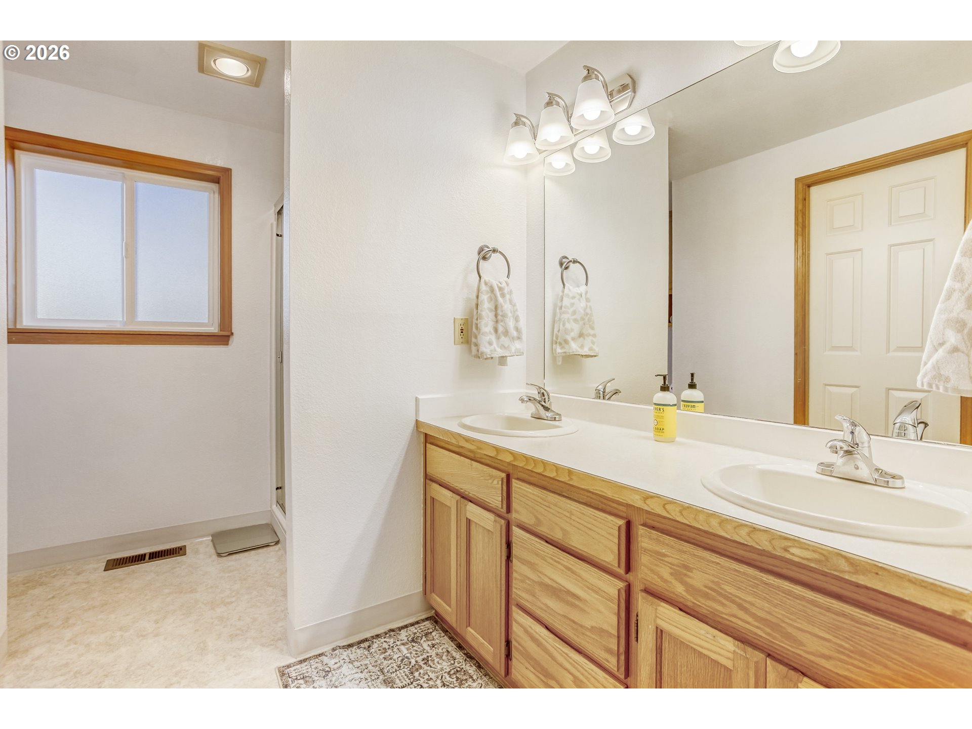 357 Southeast 7th Avenue Canby, OR 97013 - Photo 17 of 29 a bathroom with a sink vanity and a mirror