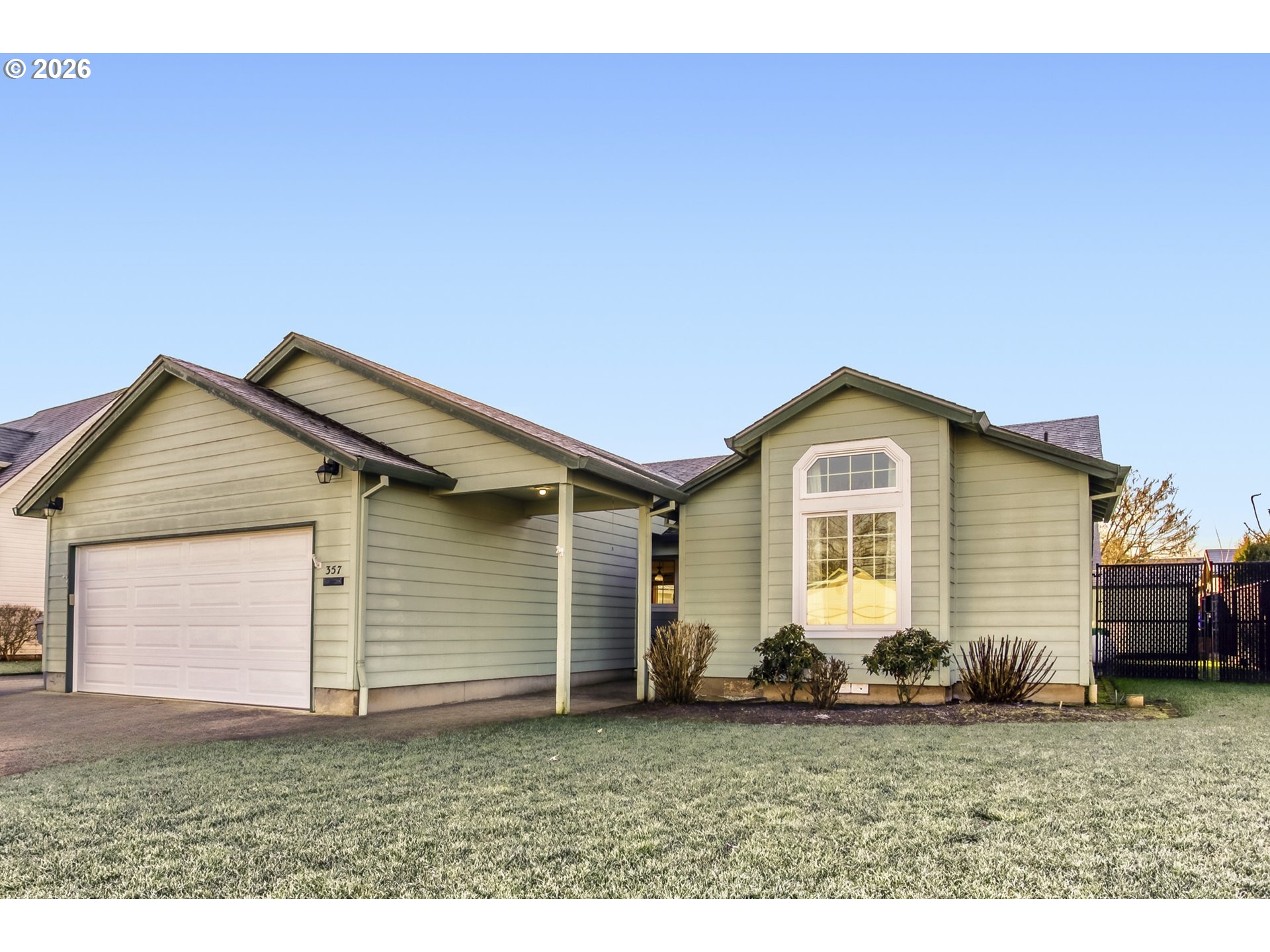 357 Southeast 7th Avenue Canby, OR 97013 - Photo 2 of 29 a front view of a house with a yard