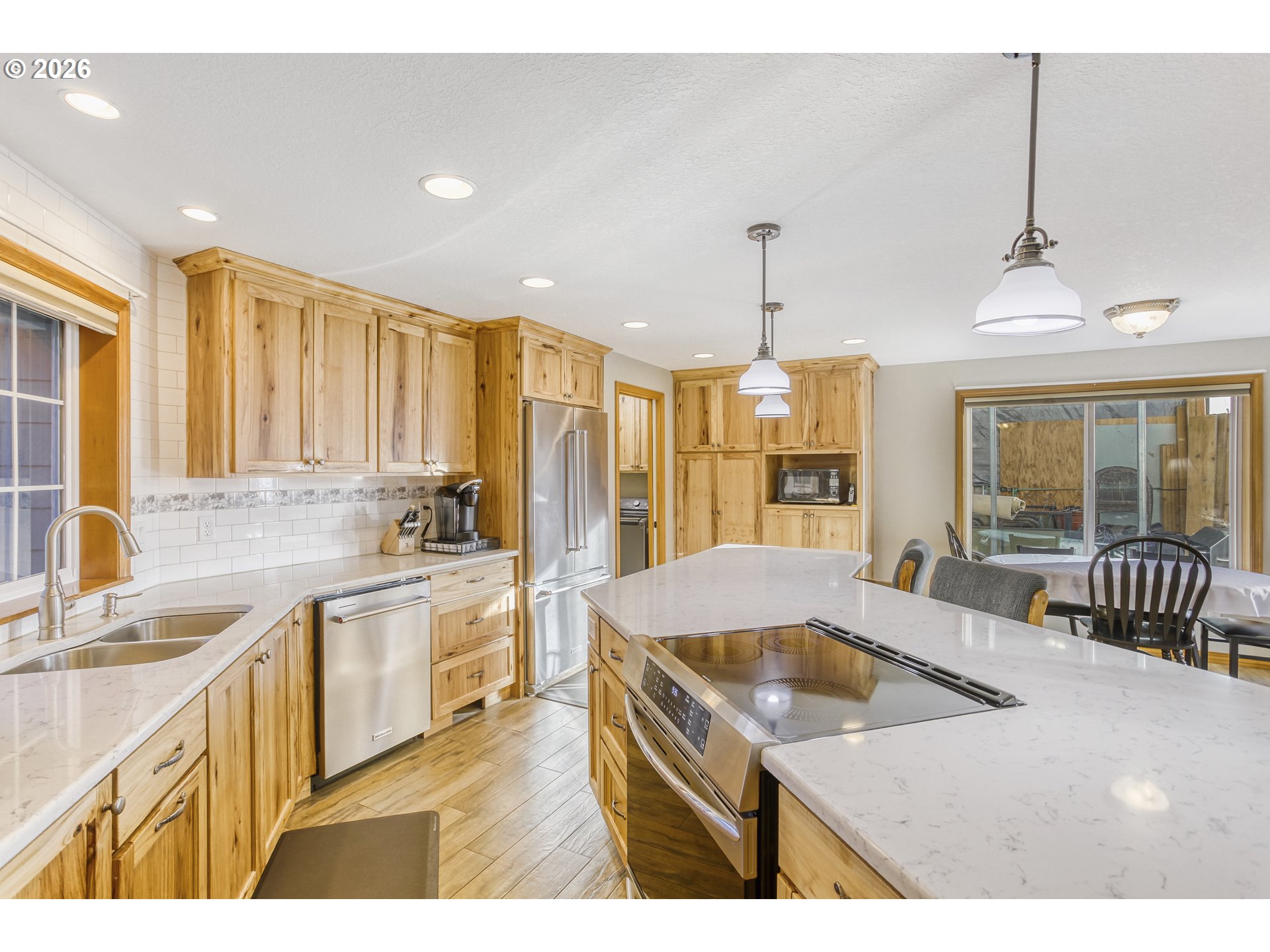 357 Southeast 7th Avenue Canby, OR 97013 - Photo 7 of 29 a kitchen with granite countertop a sink stove and cabinets