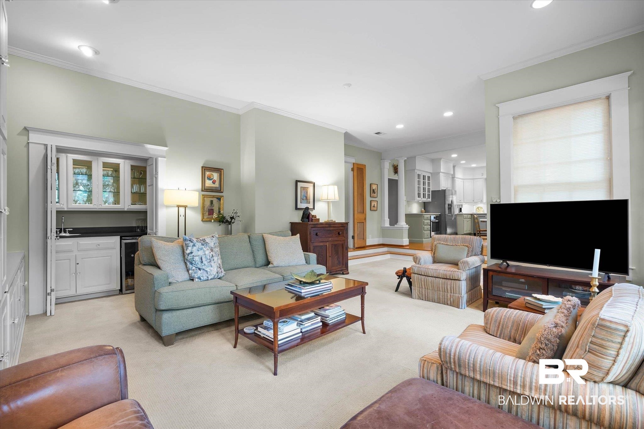 2 Westgate Road Mobile, AL 36608 - Photo 19 of 63 Living area with crown molding, light colored carpet, recessed lighting, and wine cooler