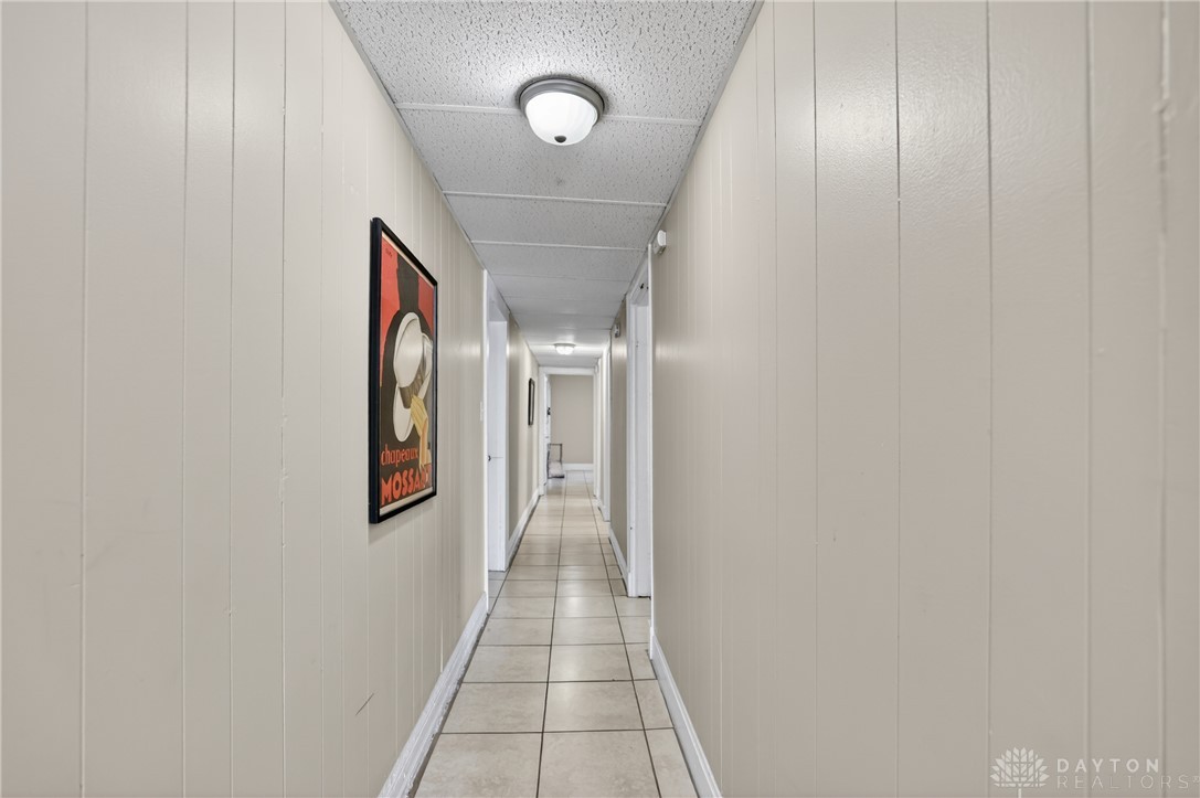 7045-7049 Montgomery Road Cincinnati, OH 45236 - Photo 52 of 68 This interior hallway features neutral tones and recessed lighting, offering a seamless flow throughout the home.