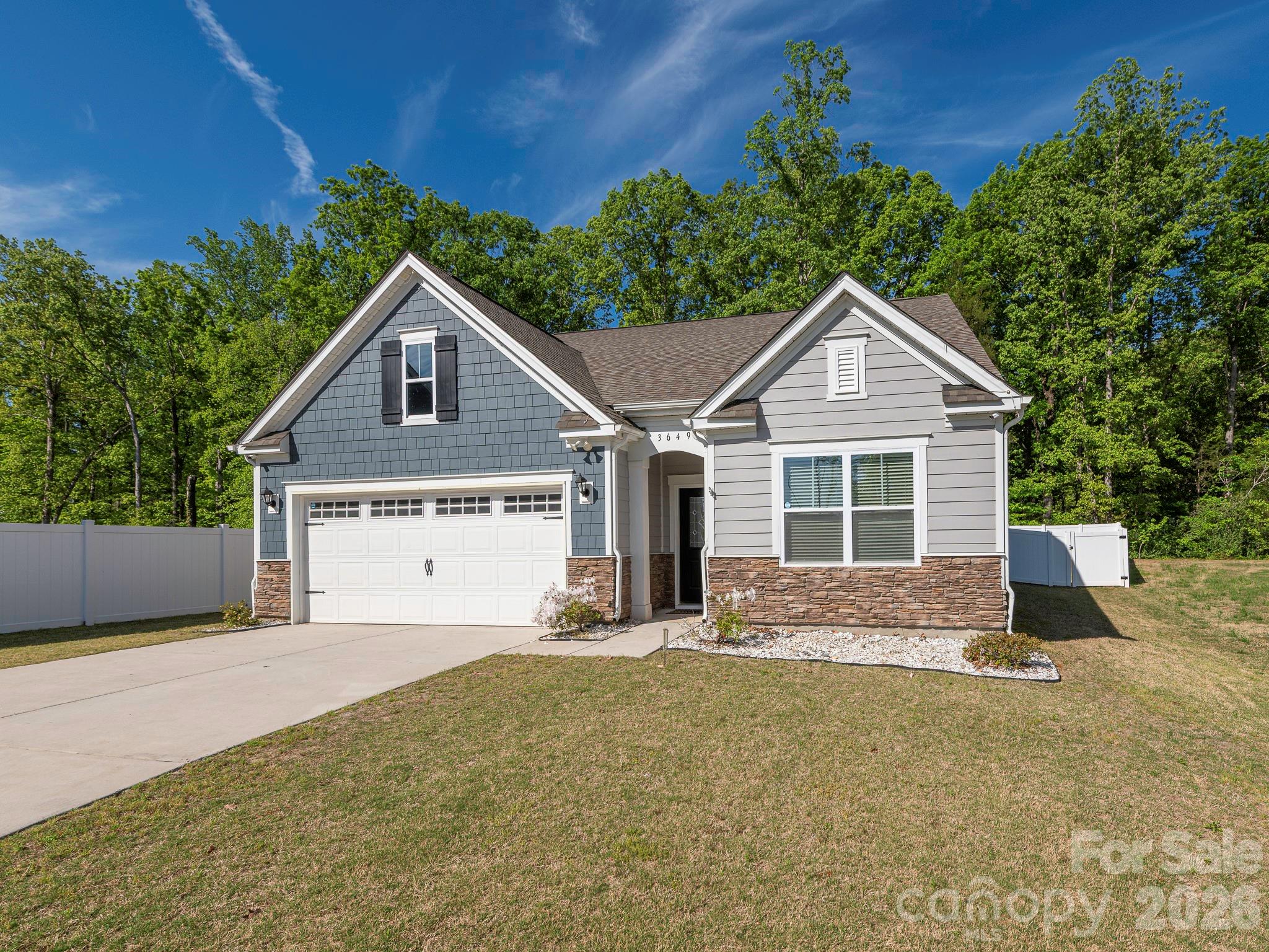 3649 Azalea Rdg Drive Mount Holly, NC 28120 - Photo 2 of 37 a front view of a house with a yard and garage