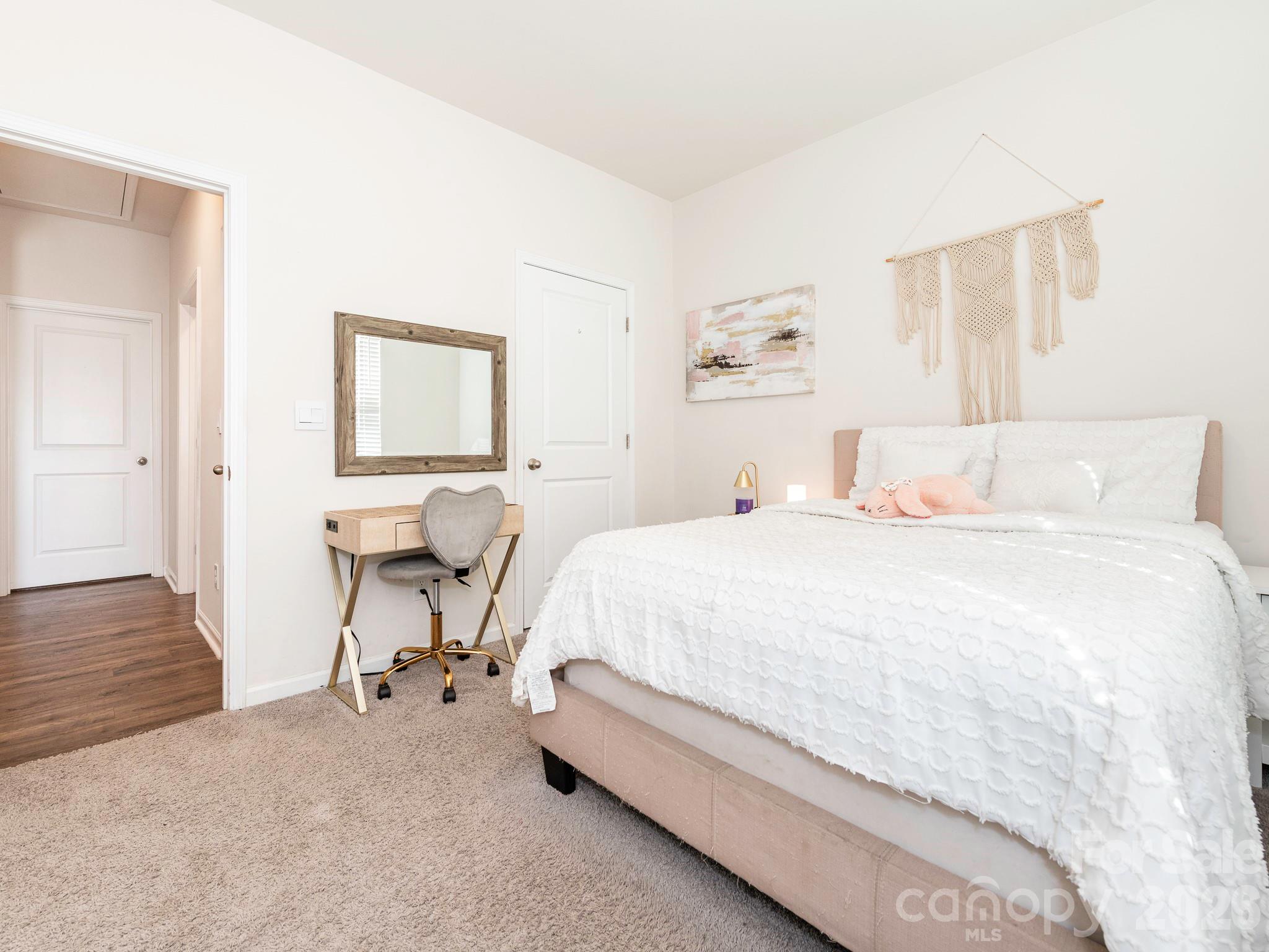 3649 Azalea Rdg Drive Mount Holly, NC 28120 - Photo 6 of 37 a spacious bedroom with a bed and a table in it