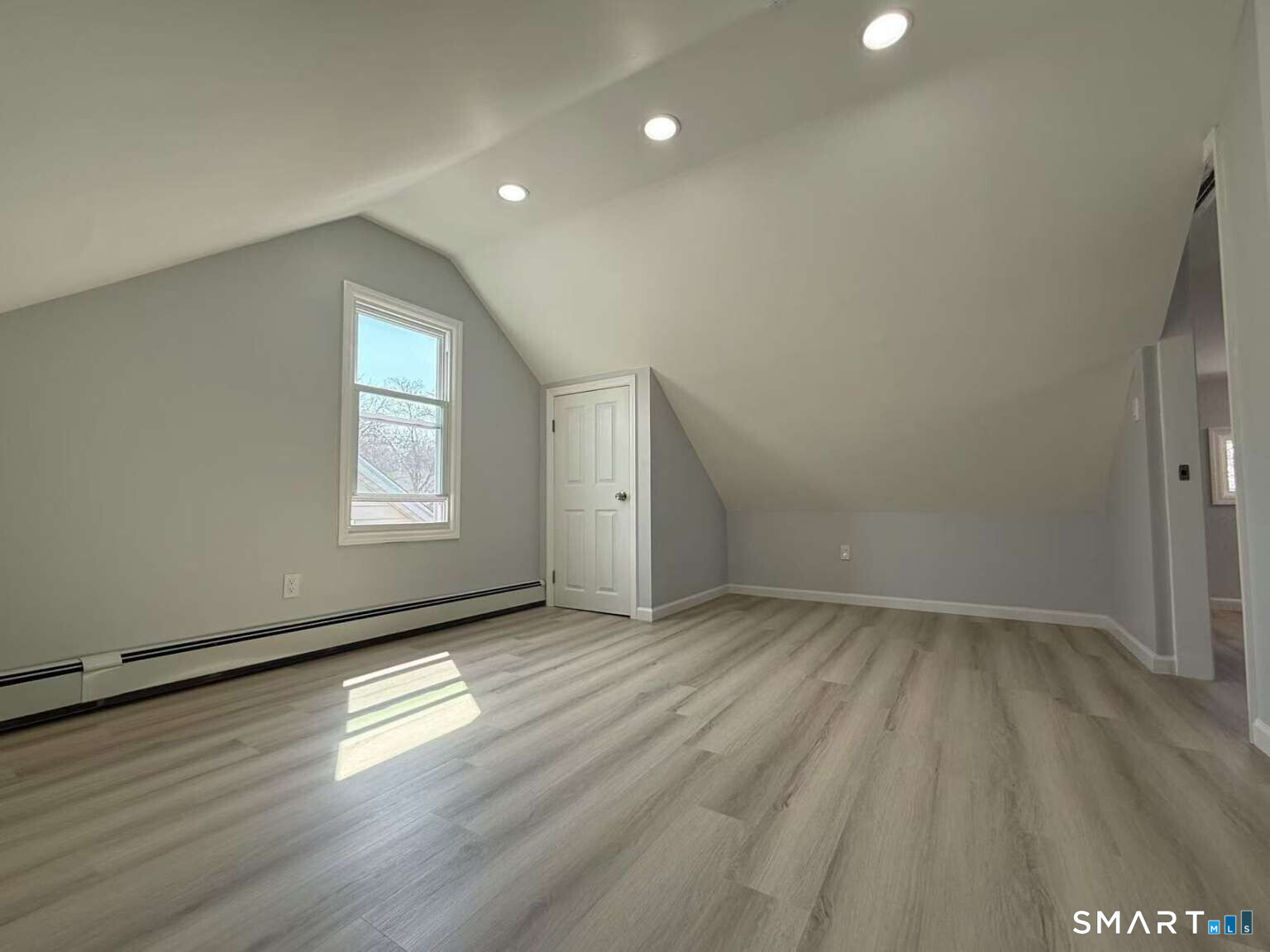 24 Paramount Avenue Hamden, CT 06517 - Photo 19 of 25 an empty room with wooden floor and windows