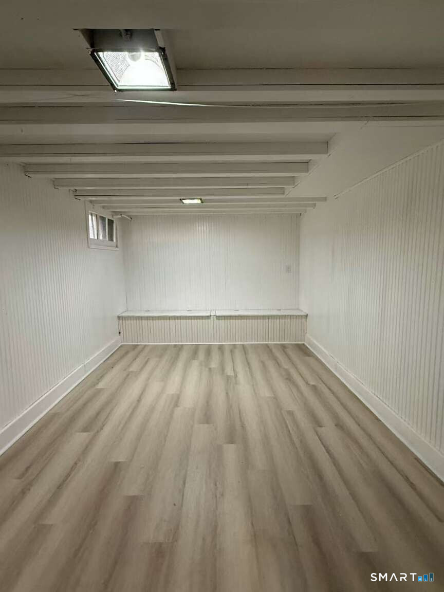 24 Paramount Avenue Hamden, CT 06517 - Photo 22 of 25 a view of a room with wooden floor and a window