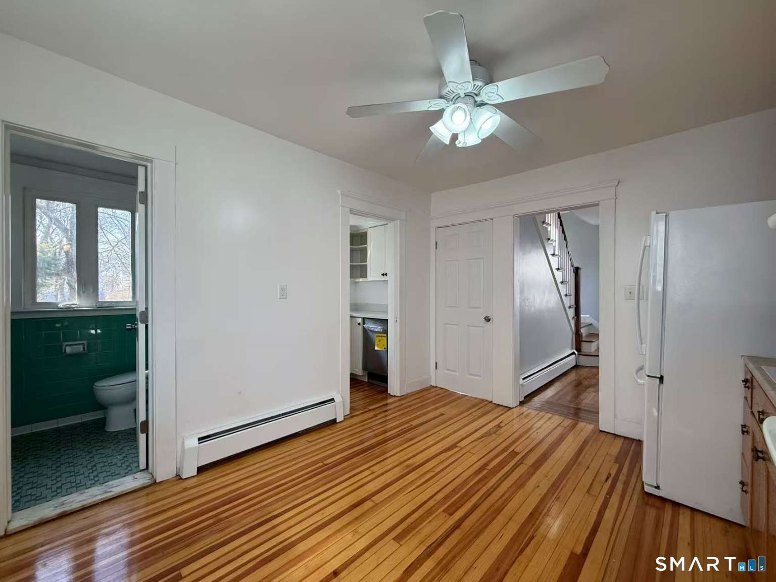 24 Paramount Avenue Hamden, CT 06517 - Photo 4 of 25 a bedroom with a bed and a chandelier