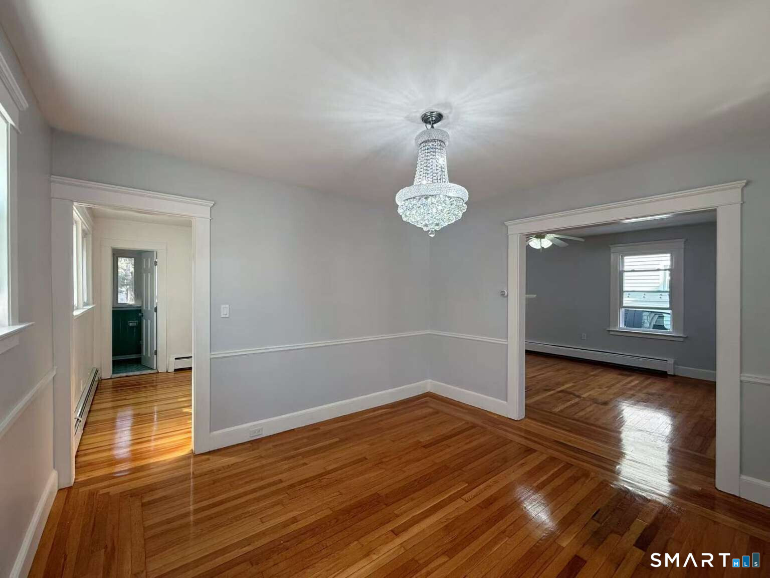 24 Paramount Avenue Hamden, CT 06517 - Photo 8 of 25 a view of empty room with wooden floor and window