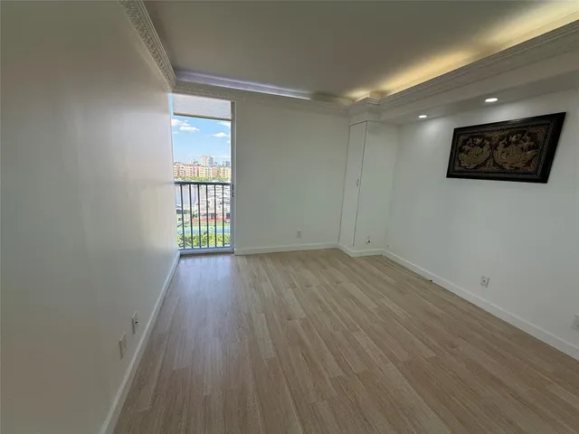 a view of an empty room with a window