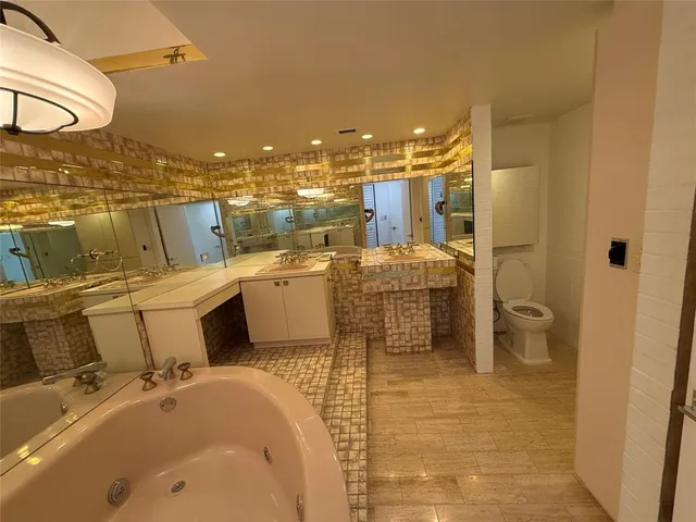 a view of a patio with a table and chairs and potted plants