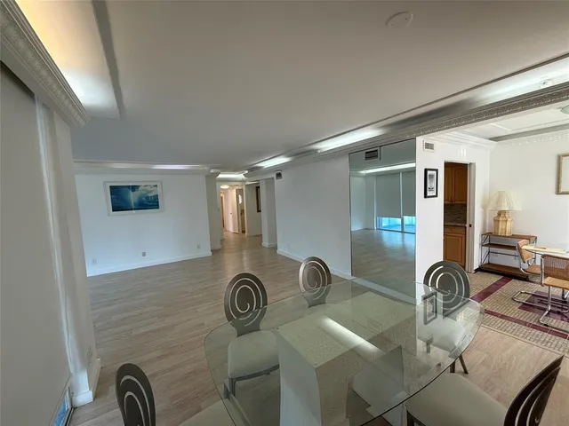 a view of a hallway with couch and front door