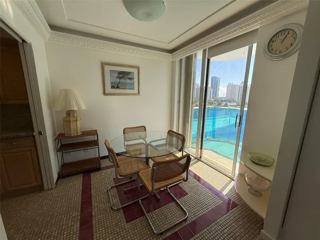 a kitchen with stainless steel appliances granite countertop wooden cabinets and a stove top oven