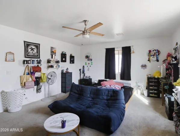 a spacious bathroom with a double vanity sink toilet and shower