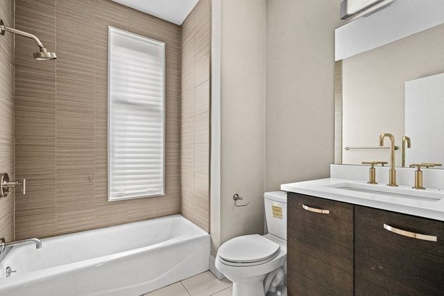 a bathroom with a sink toilet and bathtub
