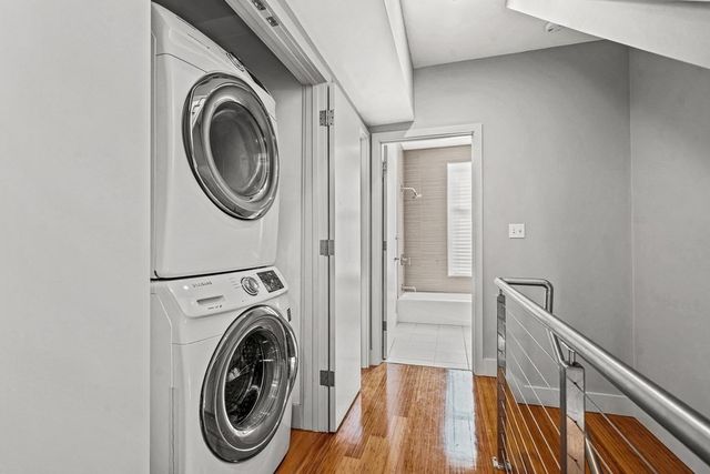 a view of a hallway with washer and dryer