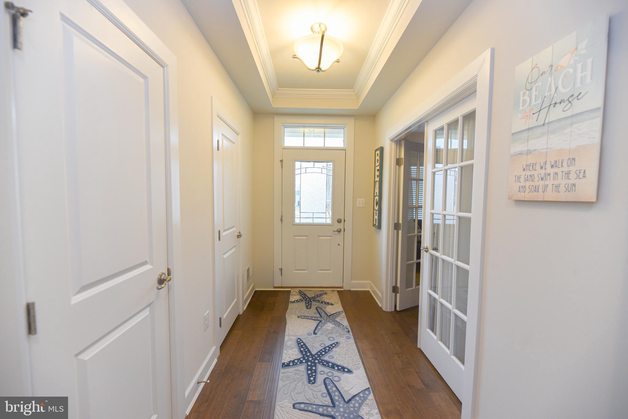 22379 Grebe Lane Ocean View, DE 19970 - Photo 11 of 41 a view of a hallway with a hardwood and front door