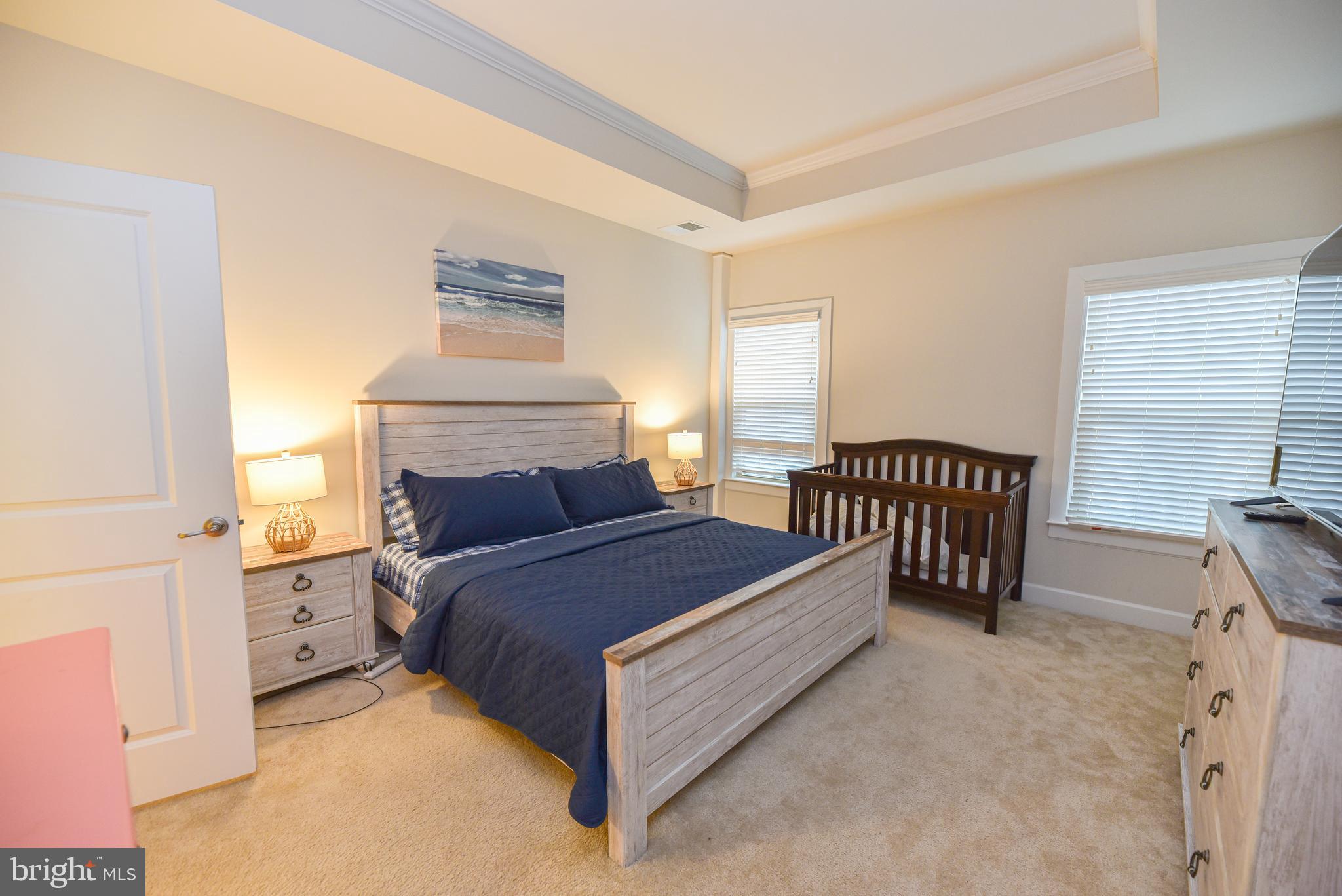 22379 Grebe Lane Ocean View, DE 19970 - Photo 19 of 41 a spacious bedroom with a bed and window