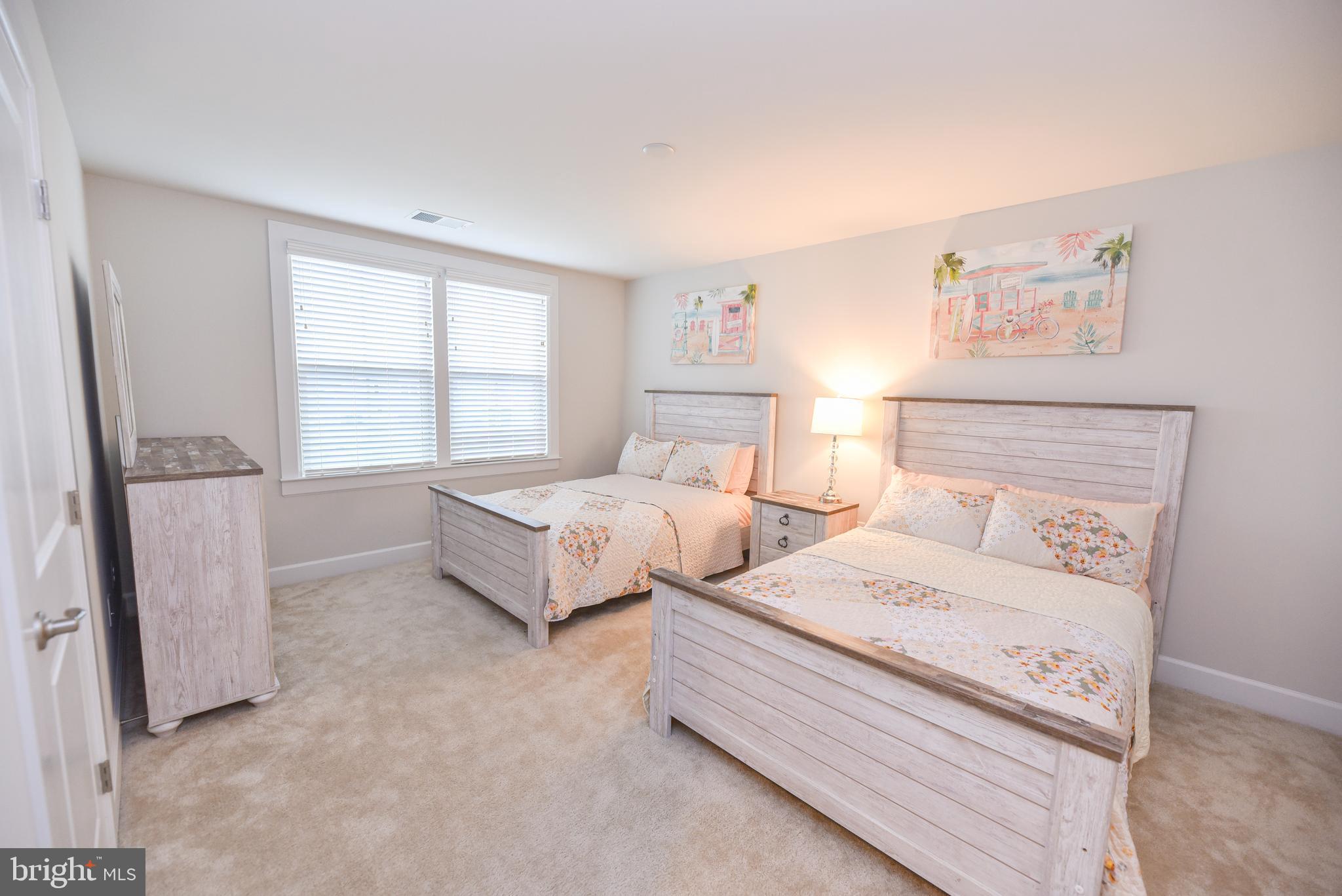 22379 Grebe Lane Ocean View, DE 19970 - Photo 28 of 41 a bedroom with a bed and a window