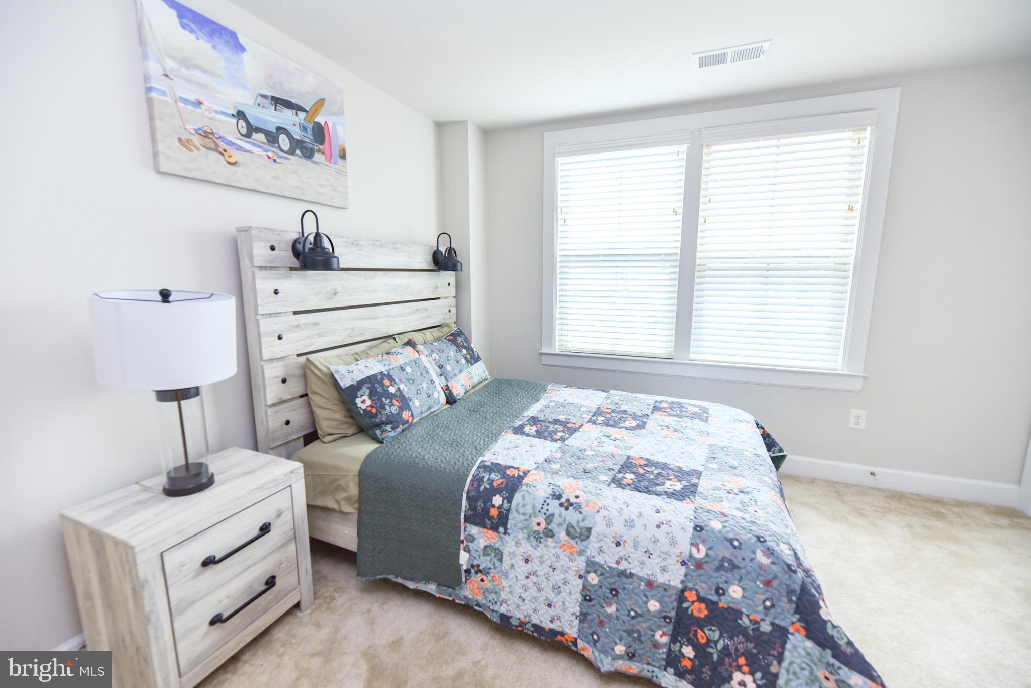 22379 Grebe Lane Ocean View, DE 19970 - Photo 31 of 41 a bedroom with a bed and a window
