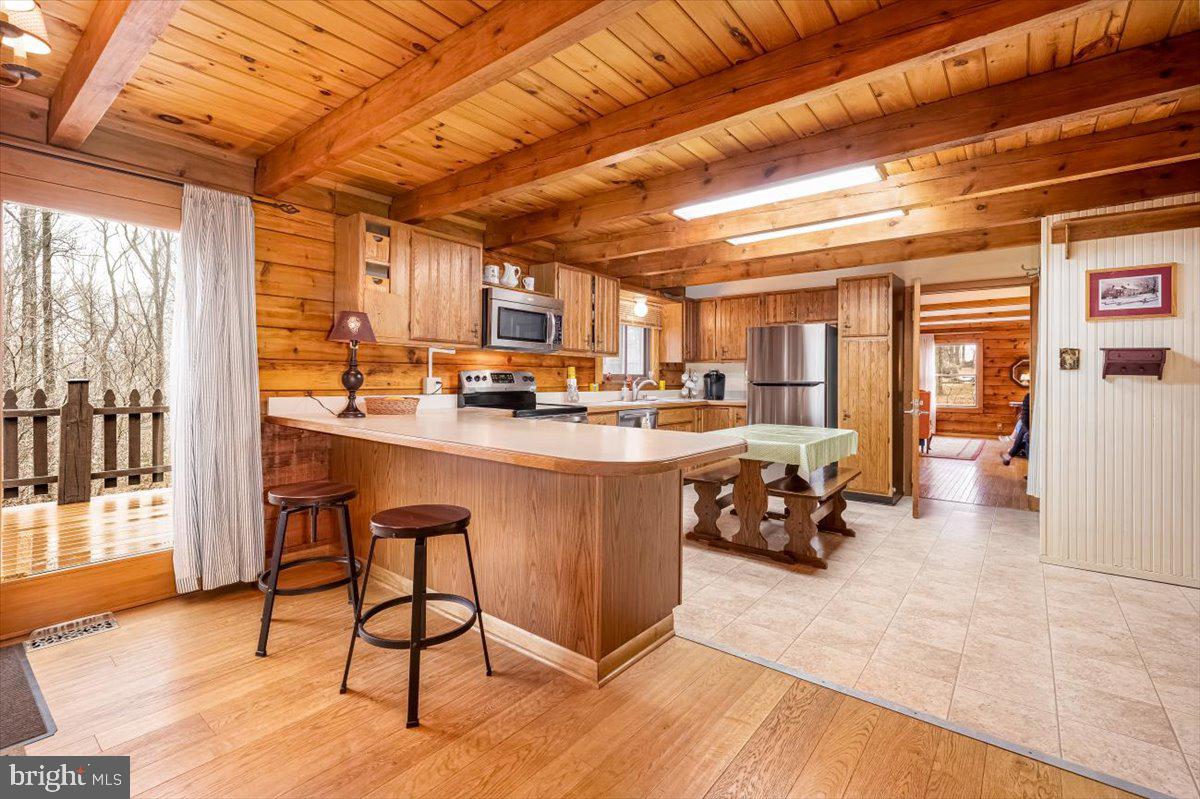 2324 Carrollton Road Westminster, MD 21157 - Photo 11 of 66 a kitchen with stainless steel appliances granite countertop a stove a sink and a refrigerator
