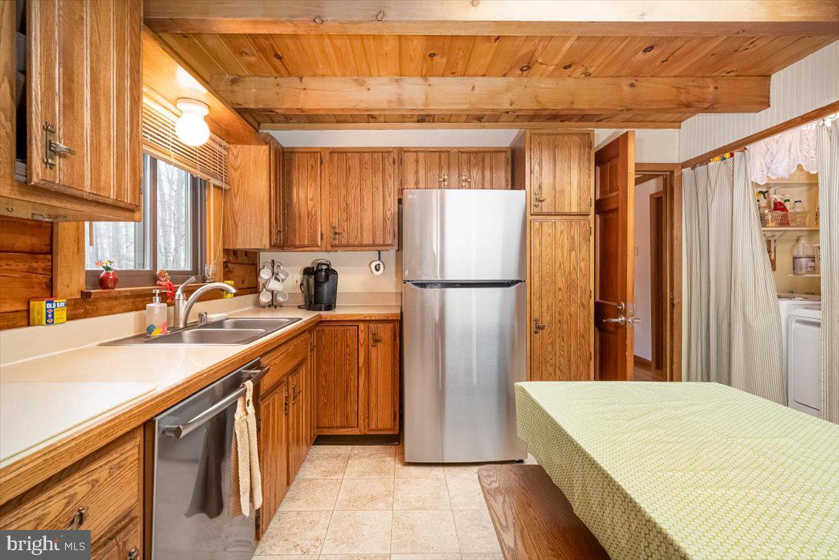 2324 Carrollton Road Westminster, MD 21157 - Photo 15 of 66 a kitchen with a refrigerator a sink and cabinets