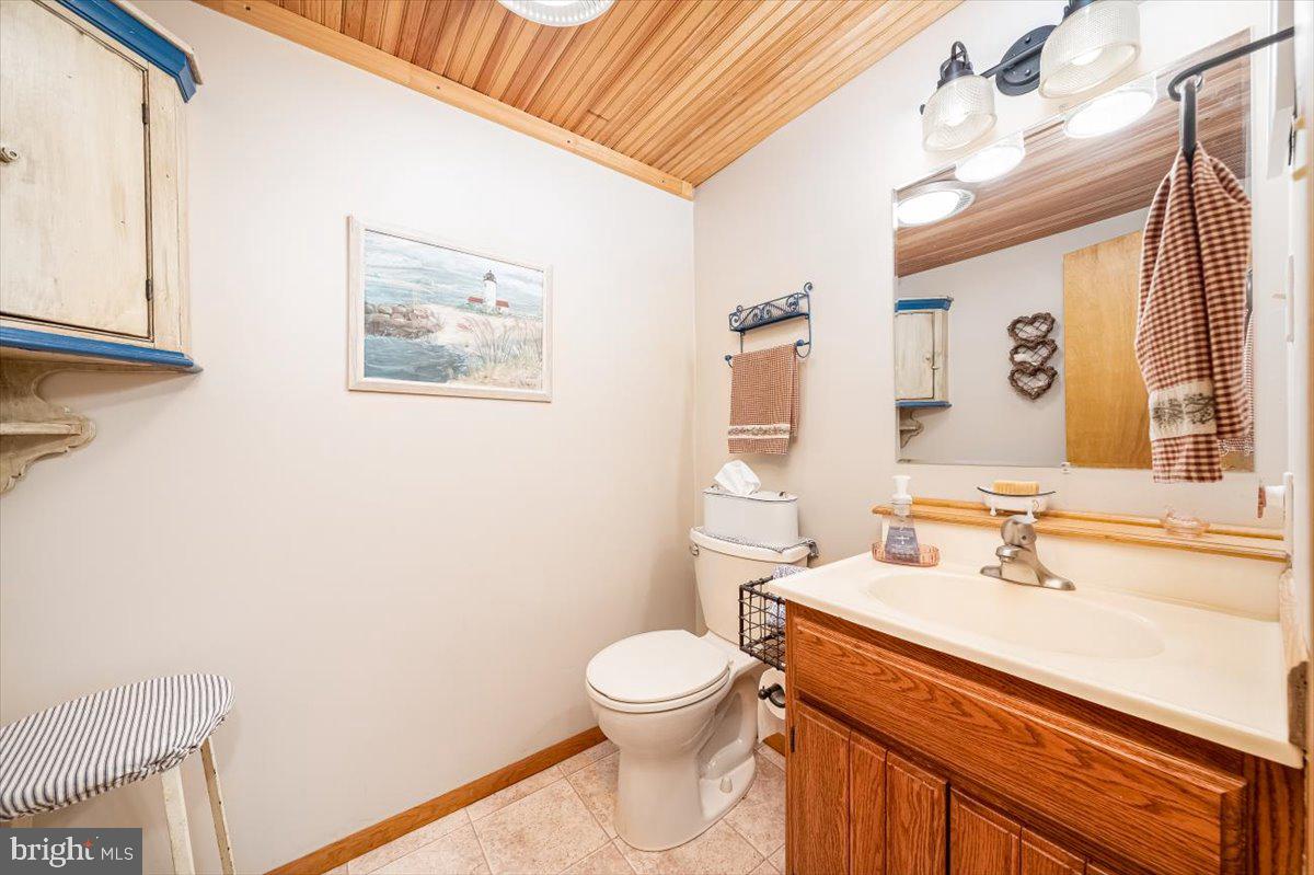 2324 Carrollton Road Westminster, MD 21157 - Photo 18 of 66 a bathroom with a toilet sink and mirror