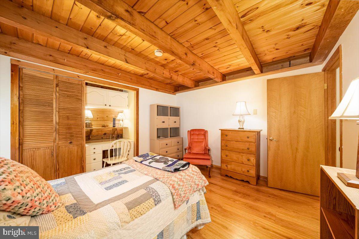 2324 Carrollton Road Westminster, MD 21157 - Photo 21 of 66 a bedroom with a bed and wooden floor