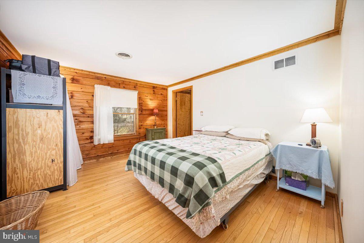 2324 Carrollton Road Westminster, MD 21157 - Photo 27 of 66 a bedroom with a bed lamp on table and a large window