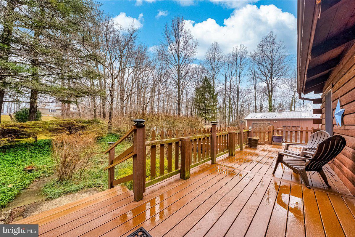 2324 Carrollton Road Westminster, MD 21157 - Photo 3 of 66 a view of a balcony with chairs and wooden floor
