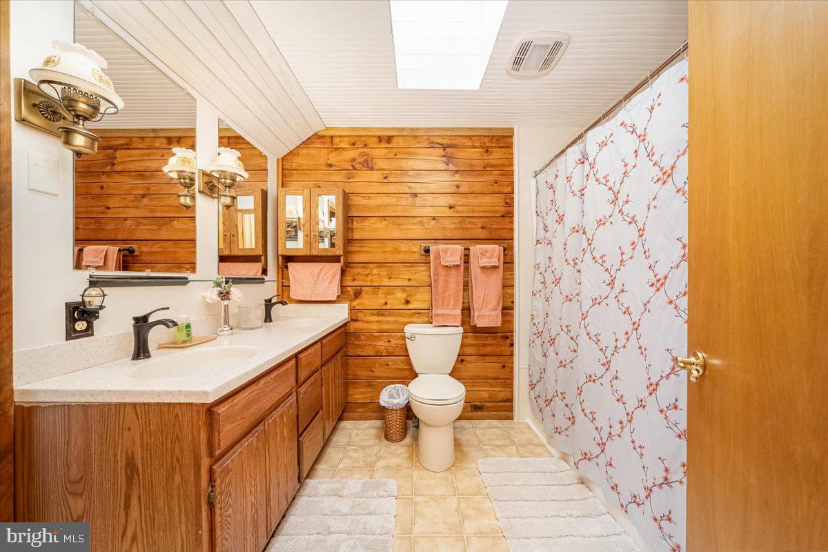 2324 Carrollton Road Westminster, MD 21157 - Photo 34 of 66 a bathroom with a sink toilet and shower