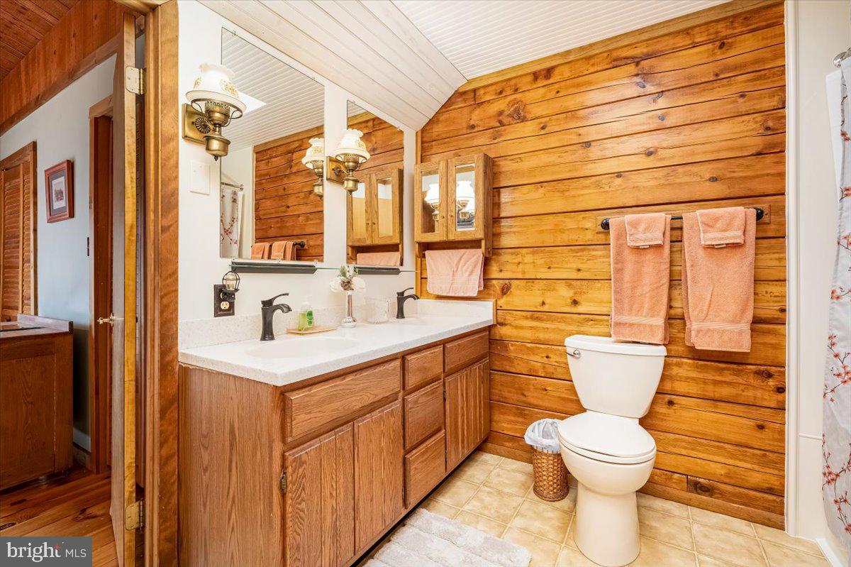 2324 Carrollton Road Westminster, MD 21157 - Photo 35 of 66 a bathroom with a toilet sink and mirror