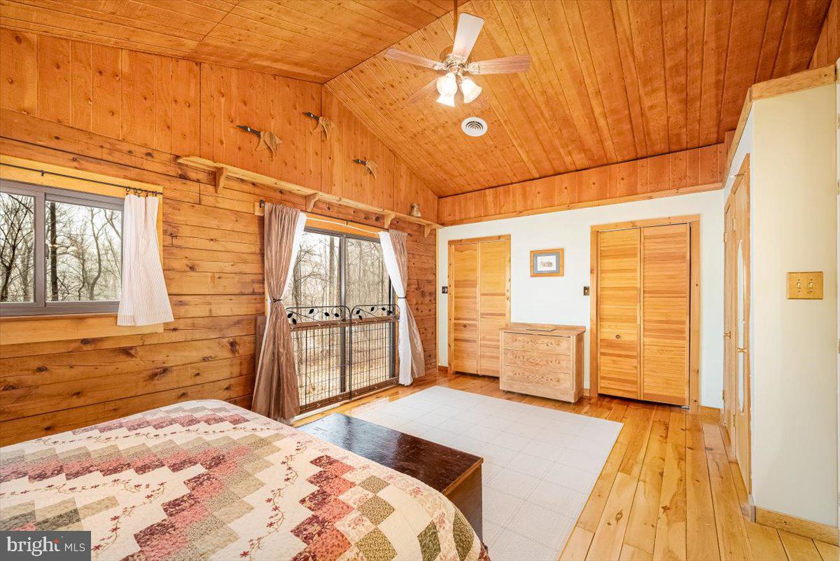 2324 Carrollton Road Westminster, MD 21157 - Photo 40 of 66 a bedroom with a bed and wooden floor