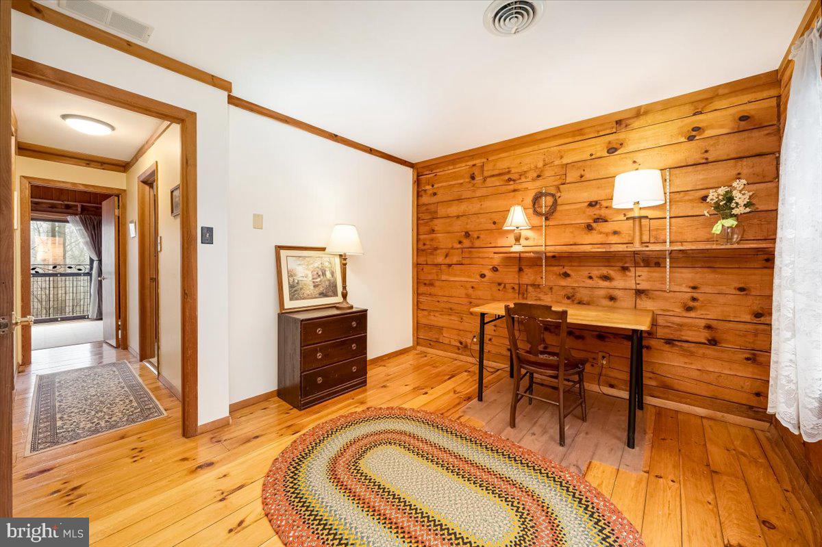 2324 Carrollton Road Westminster, MD 21157 - Photo 43 of 66 a bedroom with a bed and wooden floor