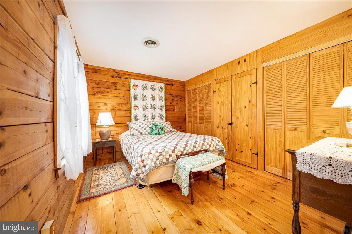 2324 Carrollton Road Westminster, MD 21157 - Photo 45 of 66 a bedroom with a bed and wooden floor