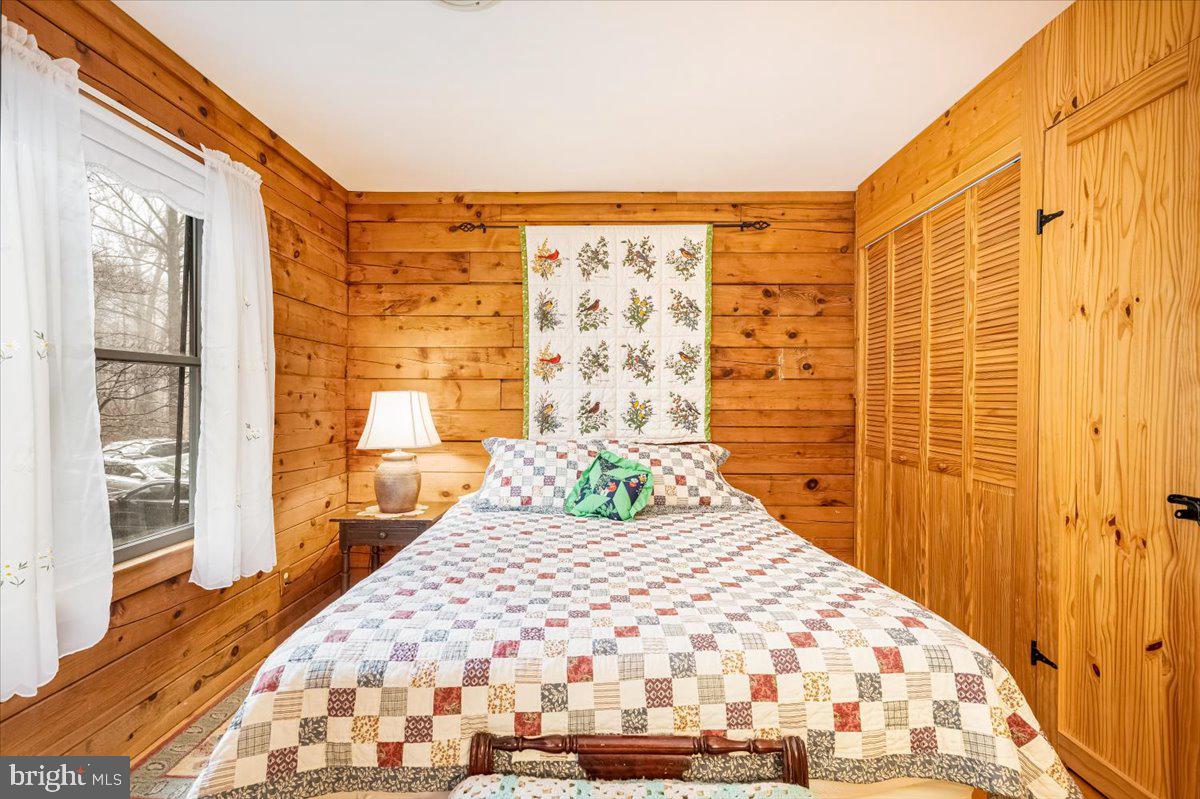 2324 Carrollton Road Westminster, MD 21157 - Photo 46 of 66 a bedroom with a bed and wooden floor