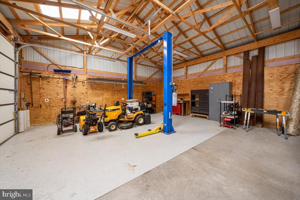 2324 Carrollton Road Westminster, MD 21157 - Photo 50 of 66 a view of a garage with a bike and wooden roof