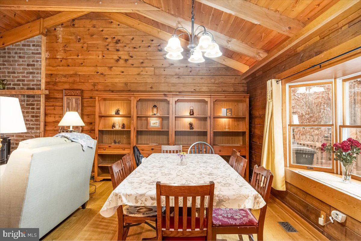 2324 Carrollton Road Westminster, MD 21157 - Photo 6 of 66 a dining room with furniture a rug and wooden floor